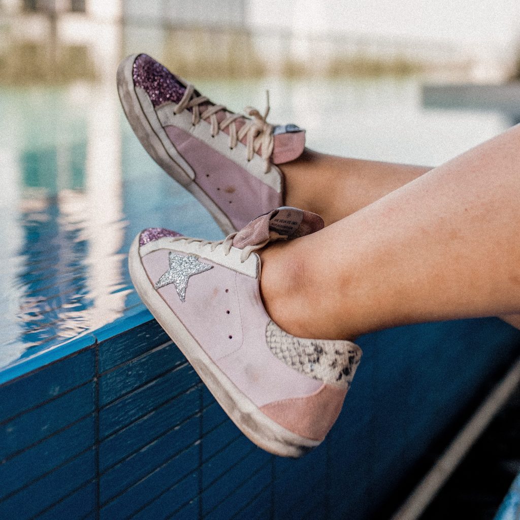 the girl in gucci glasses golden goose