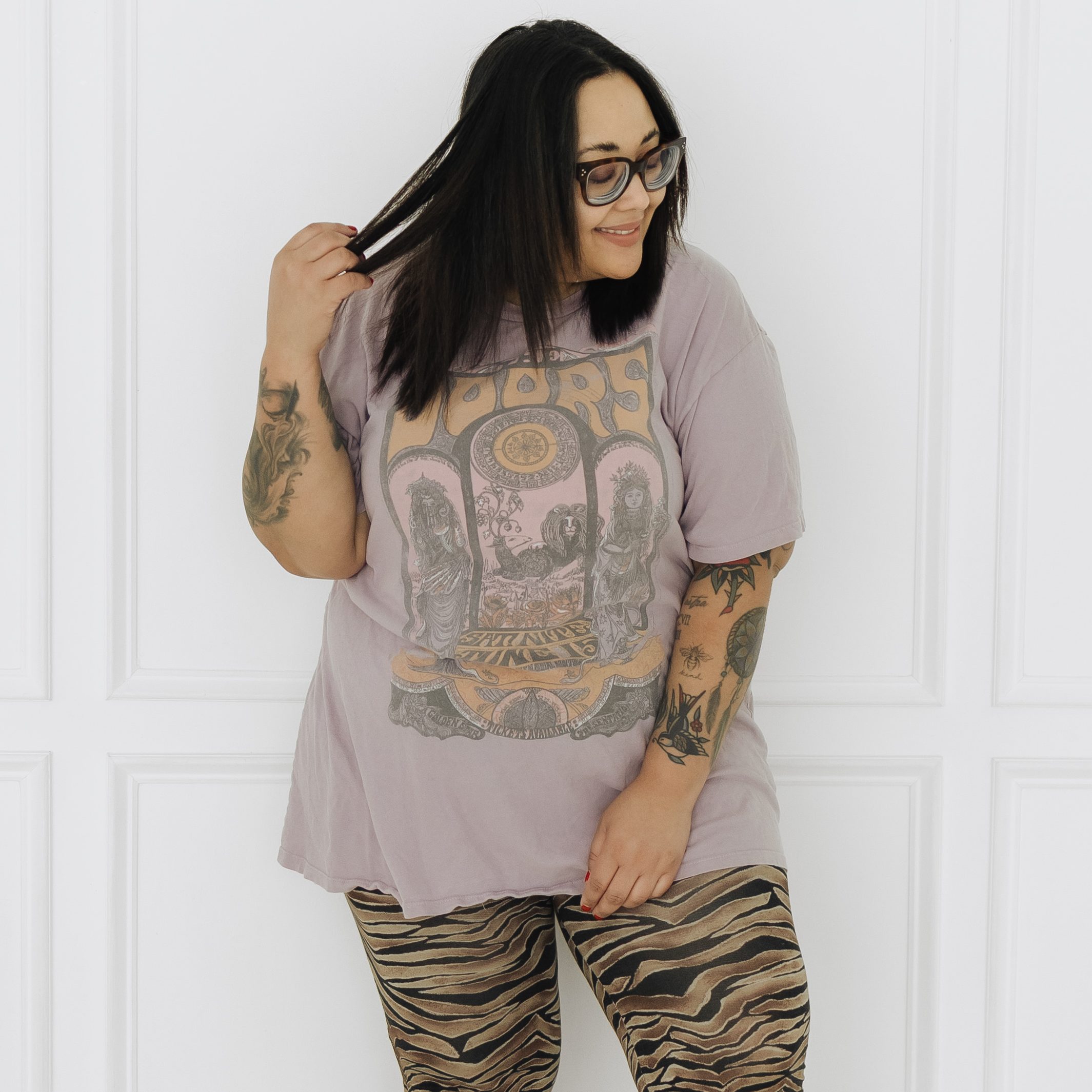 The Girl in Gucci Glasses wearing a Daydreamer The Doors graphic band tee, and SPELL bell-bottom pants for an effortless vintage-inspired boho rock outfit.
